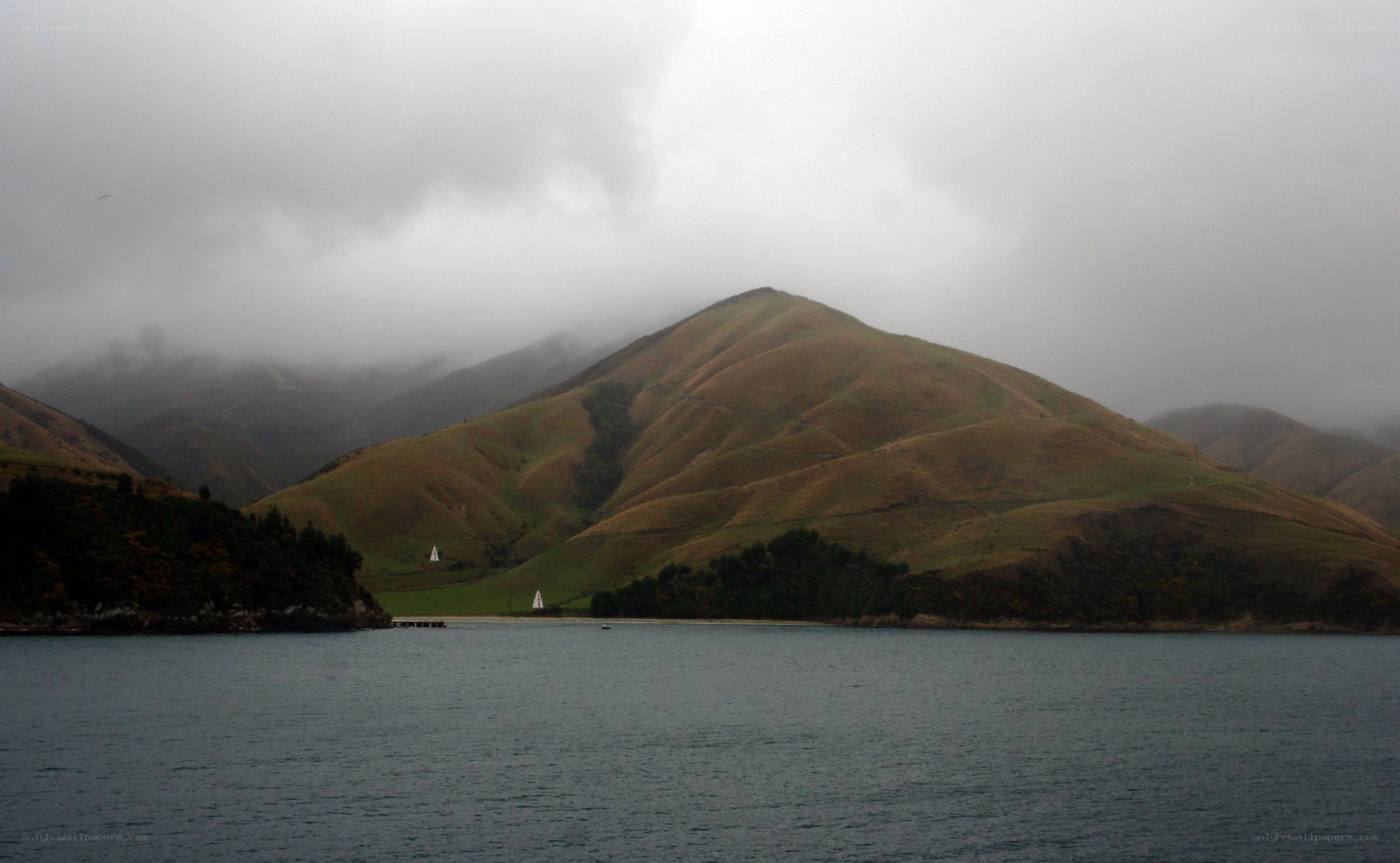 hilly landscape with foggy mountains