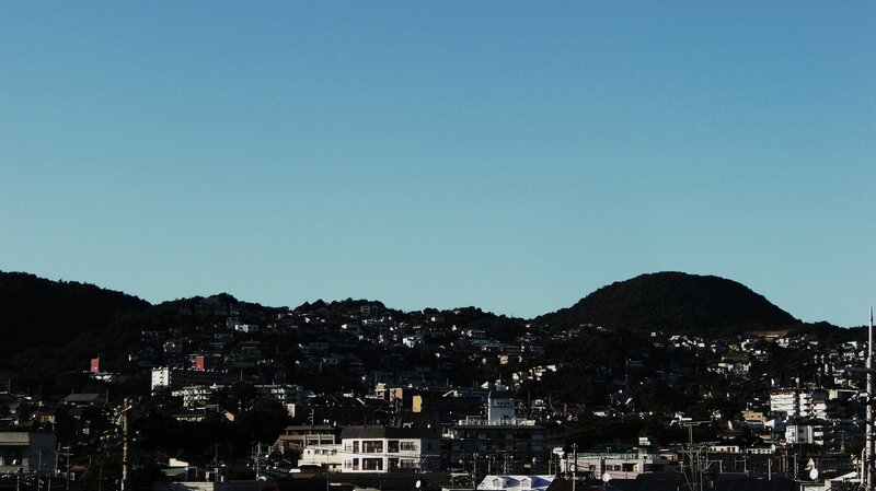 Hilly town under clear sky
