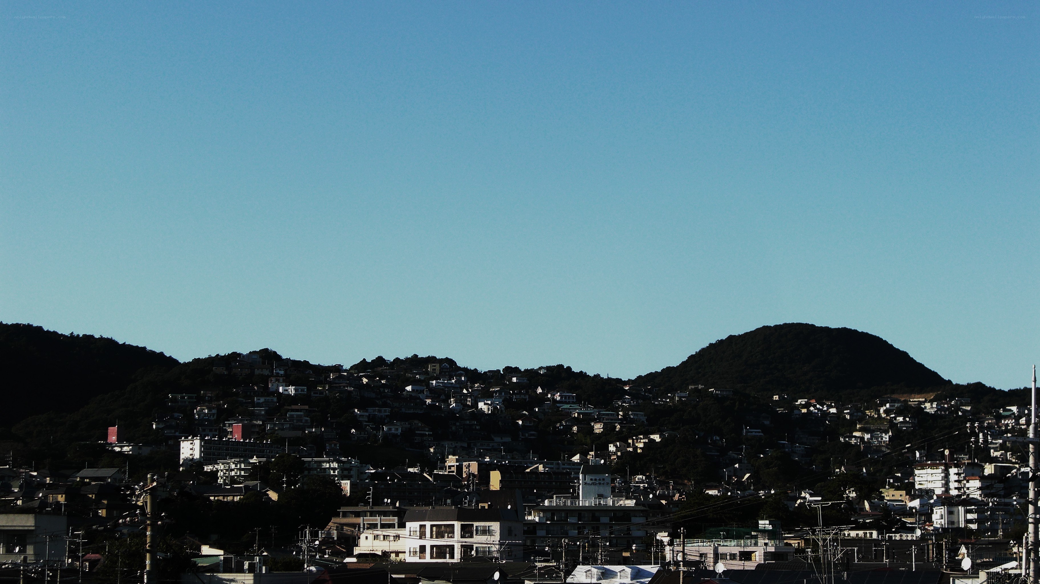 Hilly town under clear sky