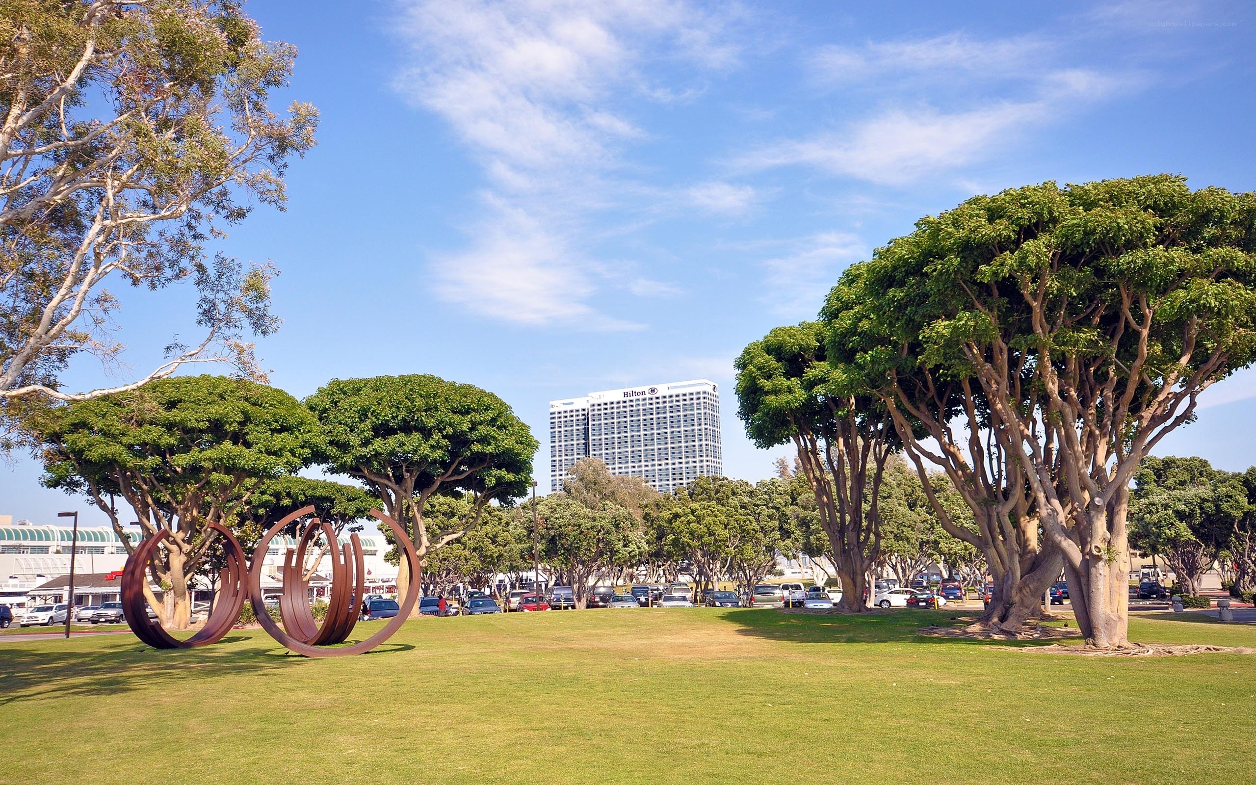 Hilton hotel with park and sculpture