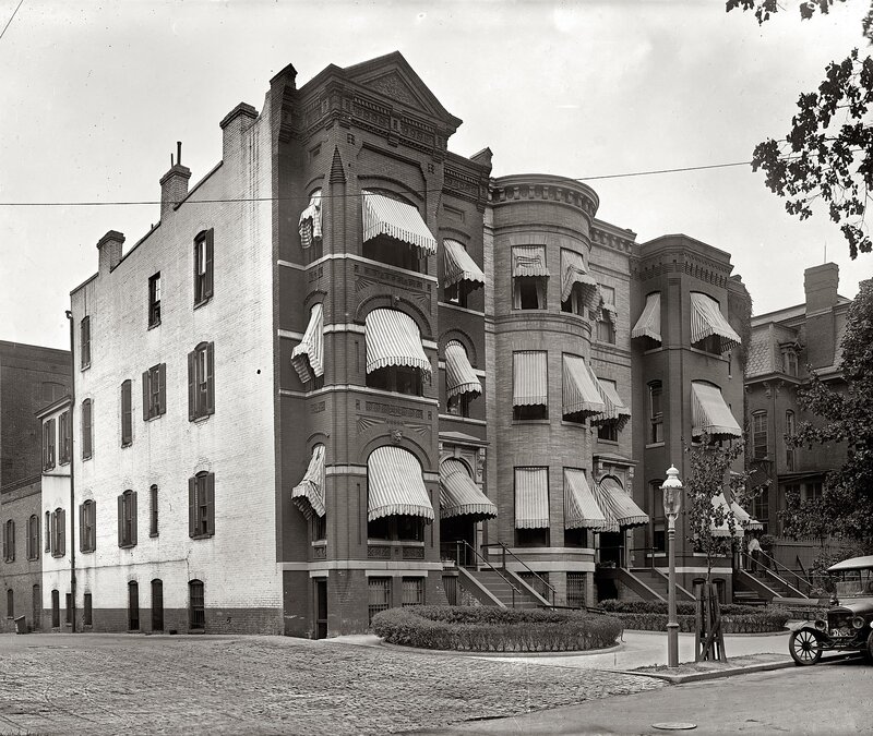 Historic apartment building with awnings