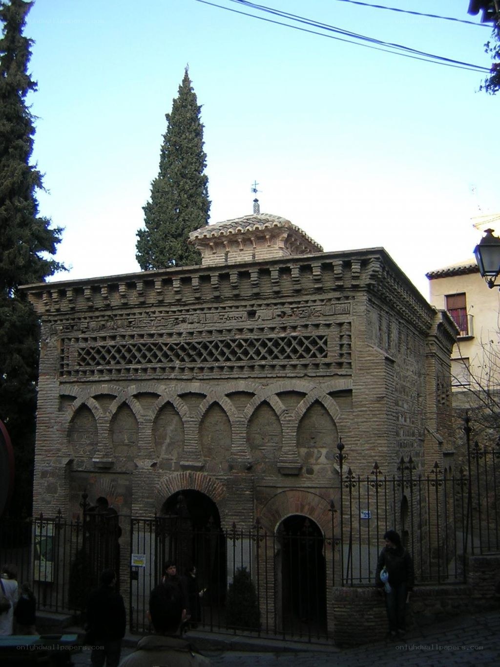 historic brick building with arched gate