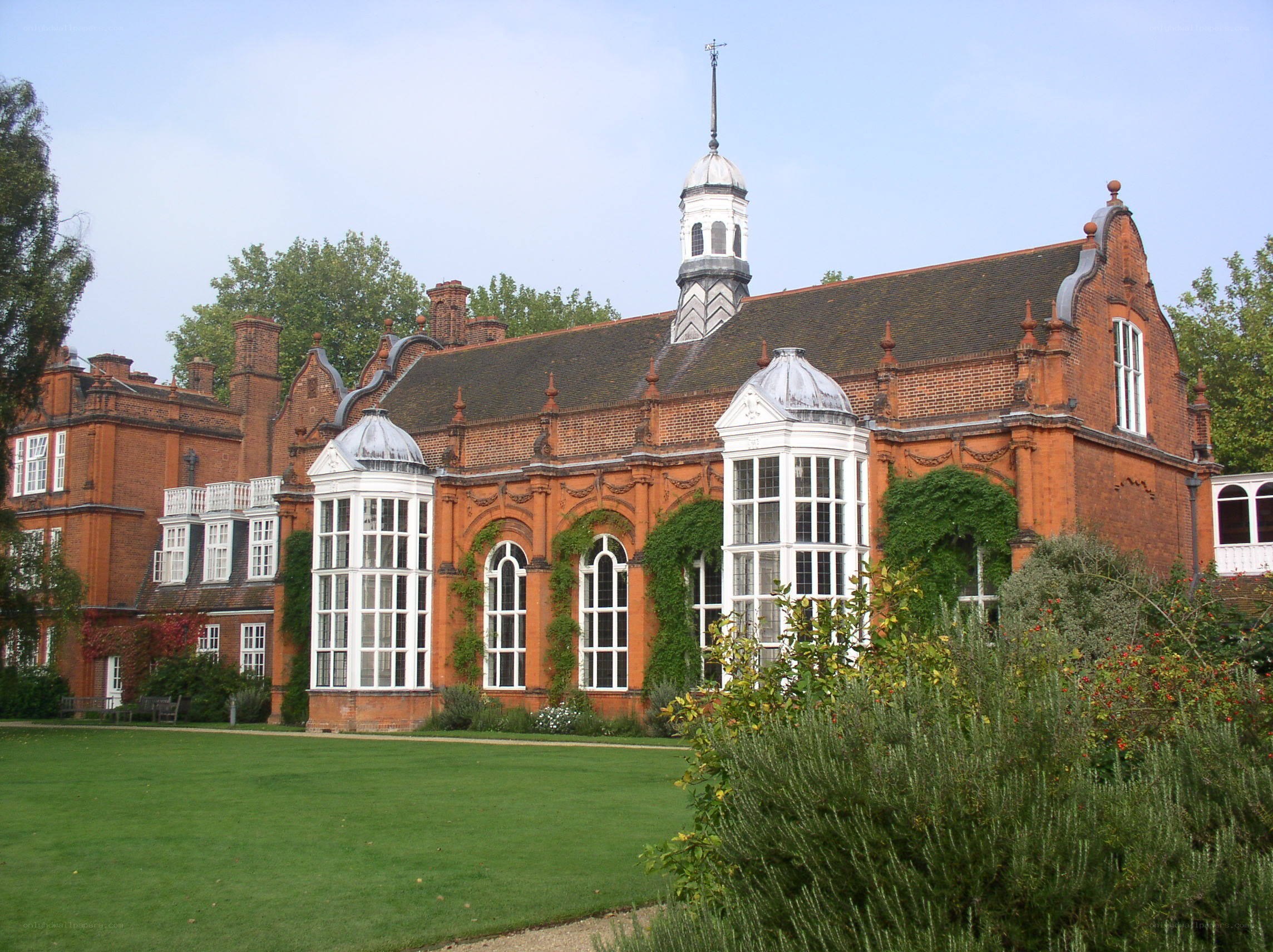 historic brick building with garden