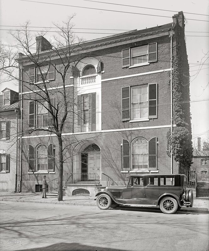 Historic brick building with vintage car