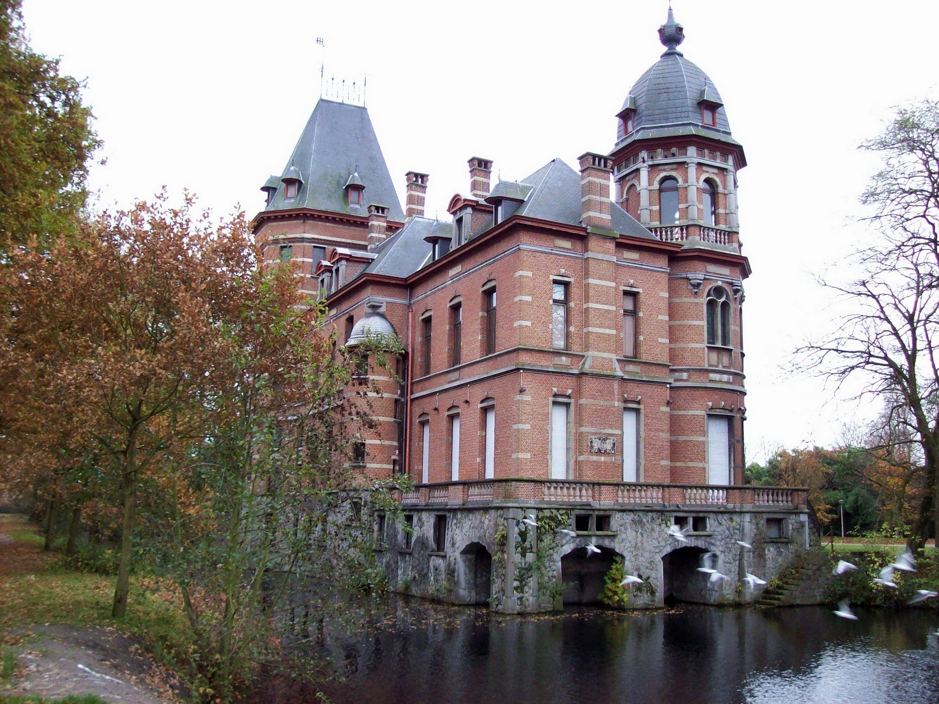 historic brick castle by a moat