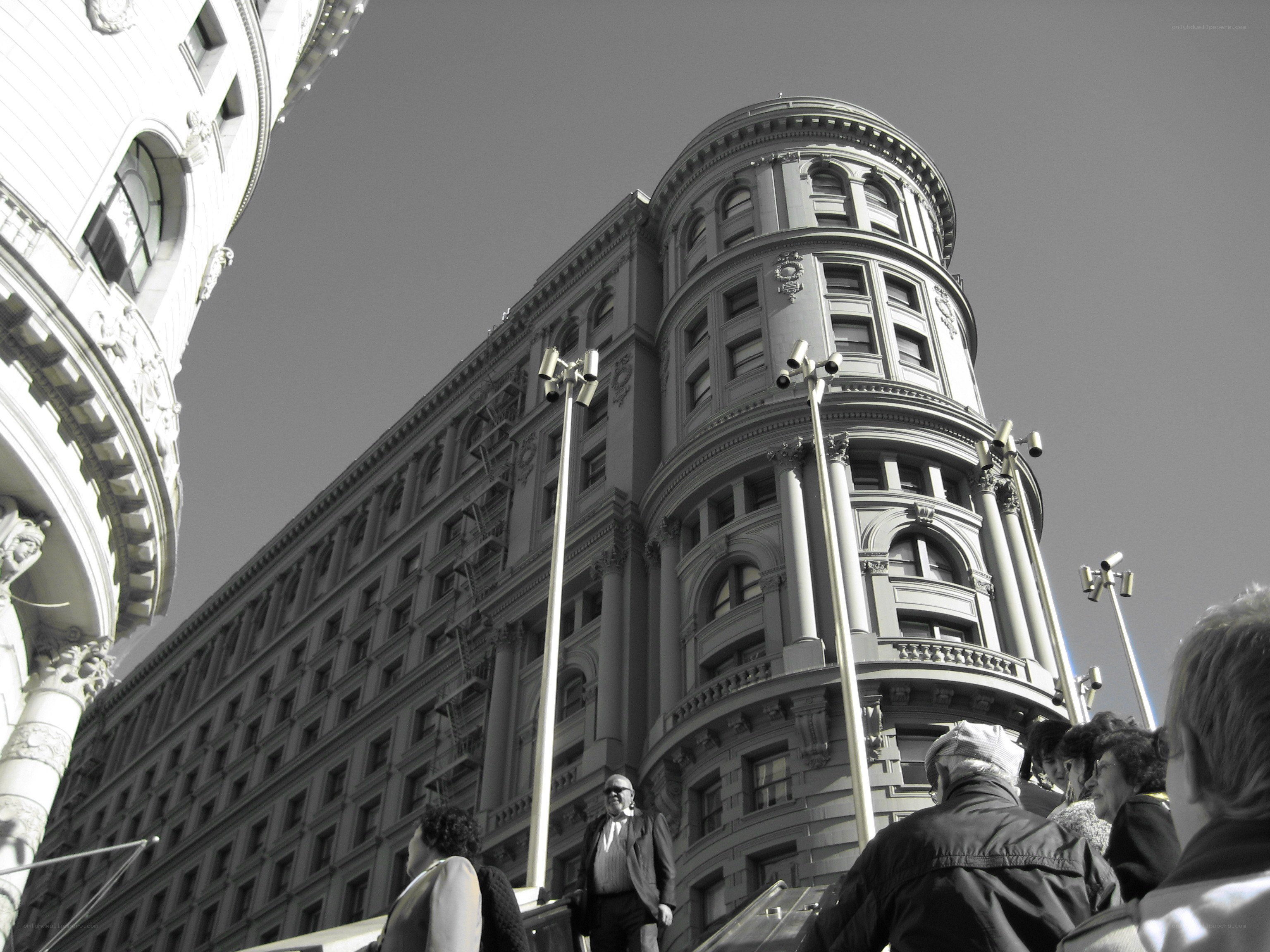 Historic building corner with people