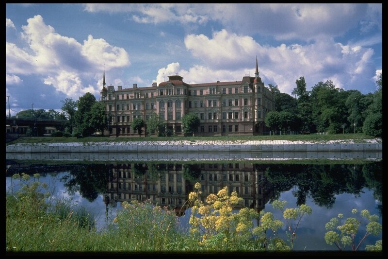 Historic building reflected in water