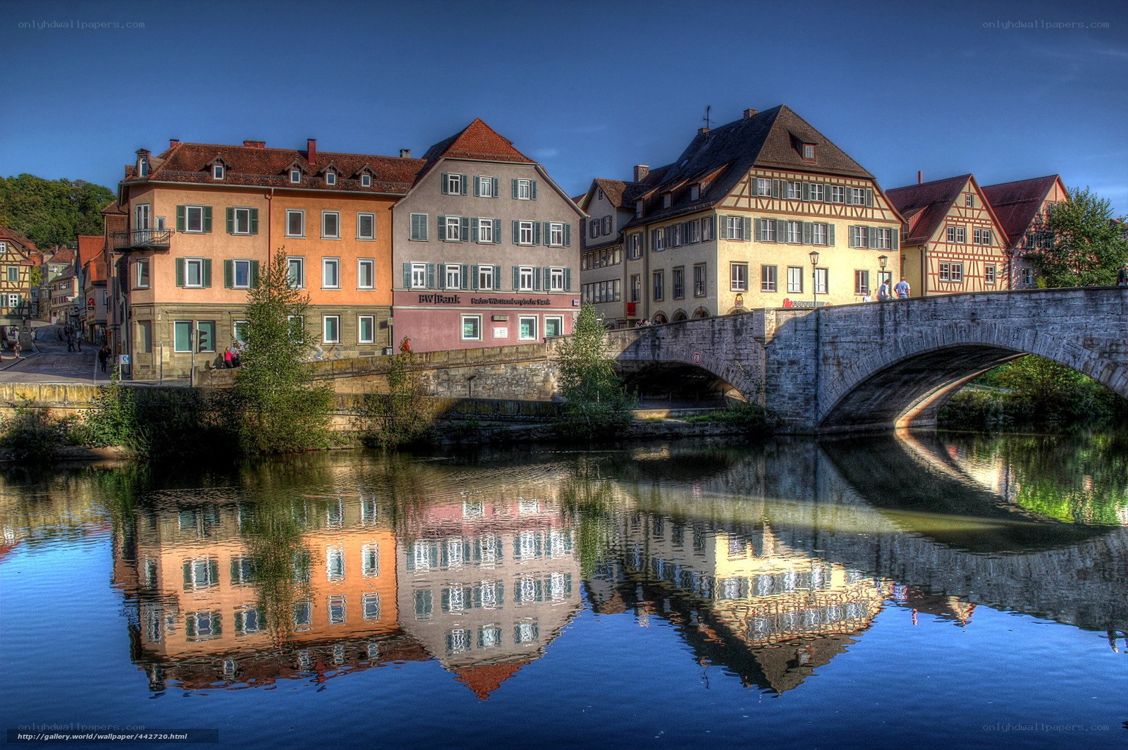 Historic buildings reflected in river