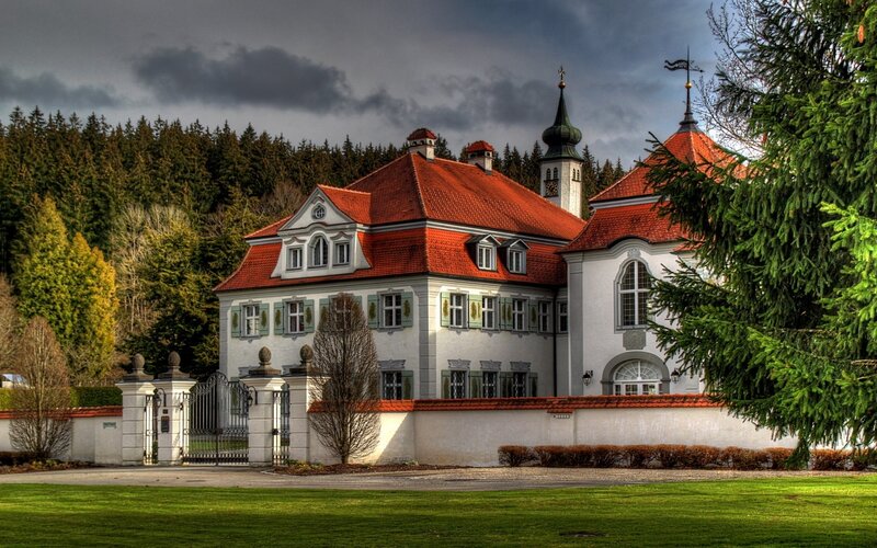 Historic mansion with red roof