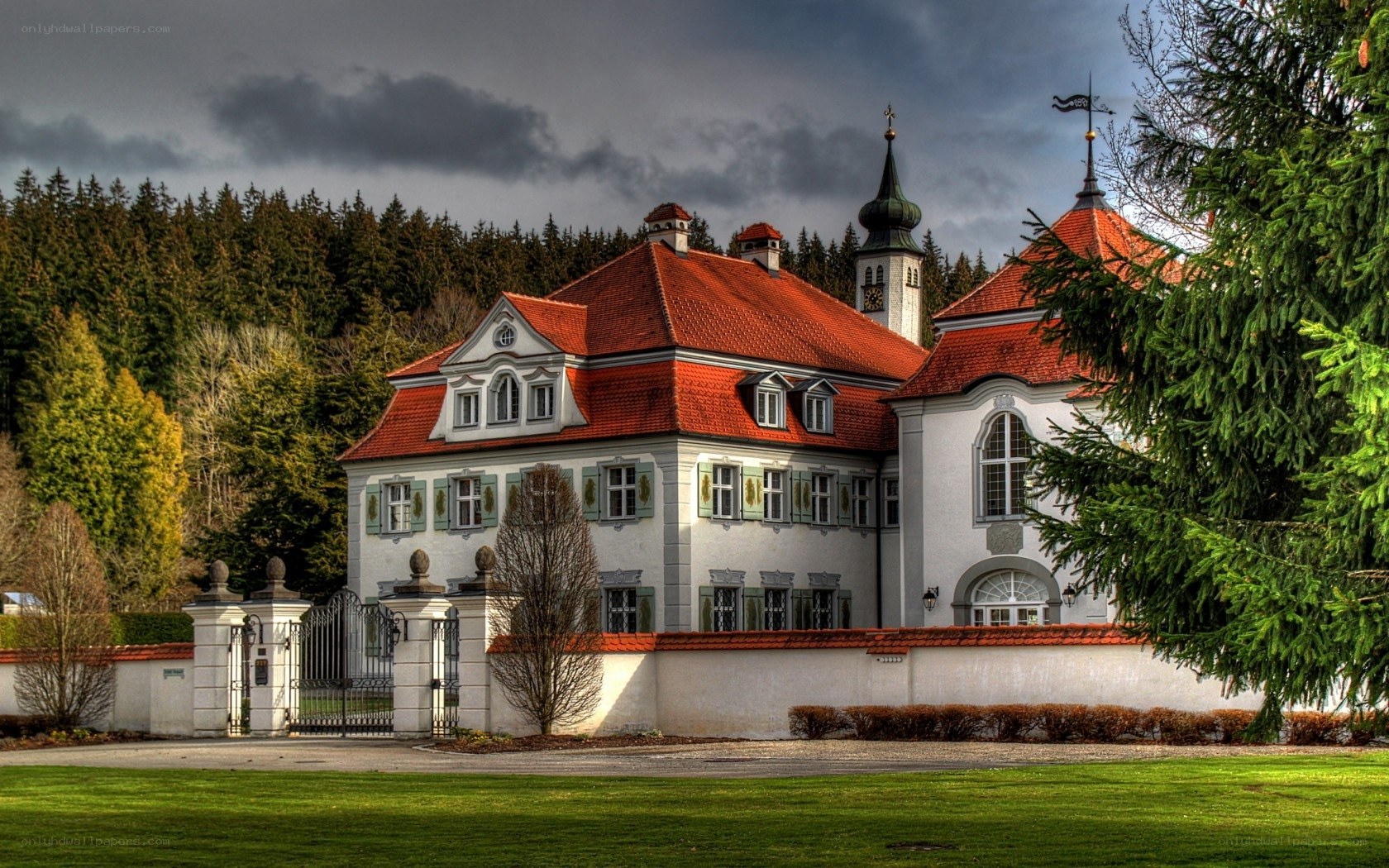 Historic mansion with red roof