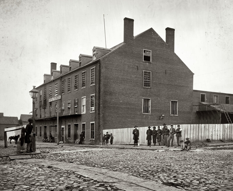 Historic prison building with soldiers
