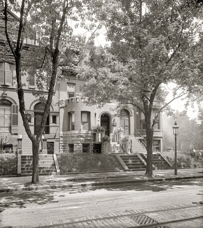 Historic row houses on a tree-lined street