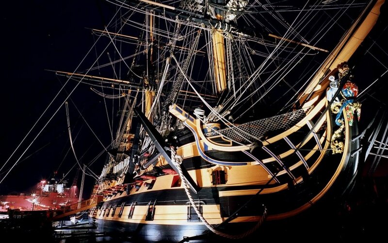 historic ship at night
