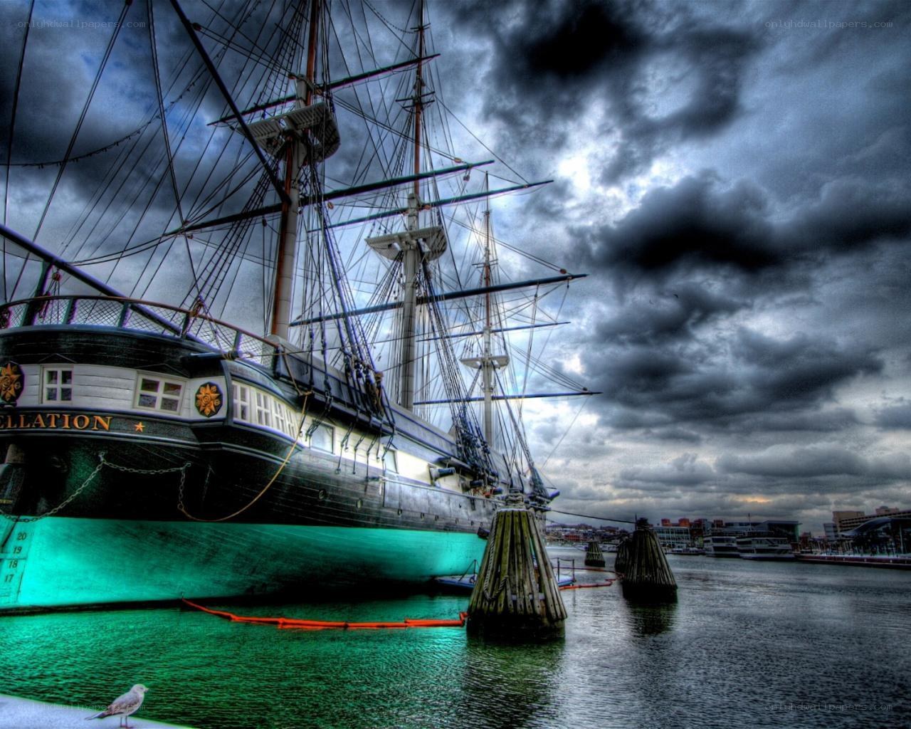 Historic ship in stormy harbor