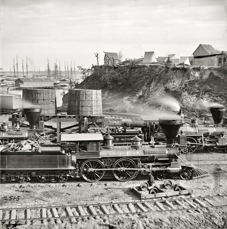 Historic steam locomotives at a port