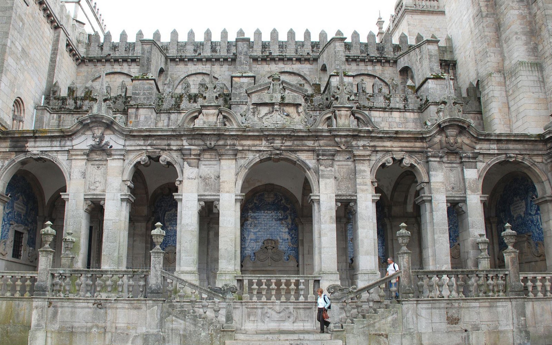 Historic stone building with arches