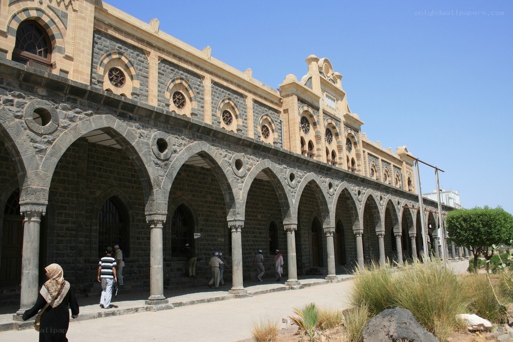 historic stone building with arches