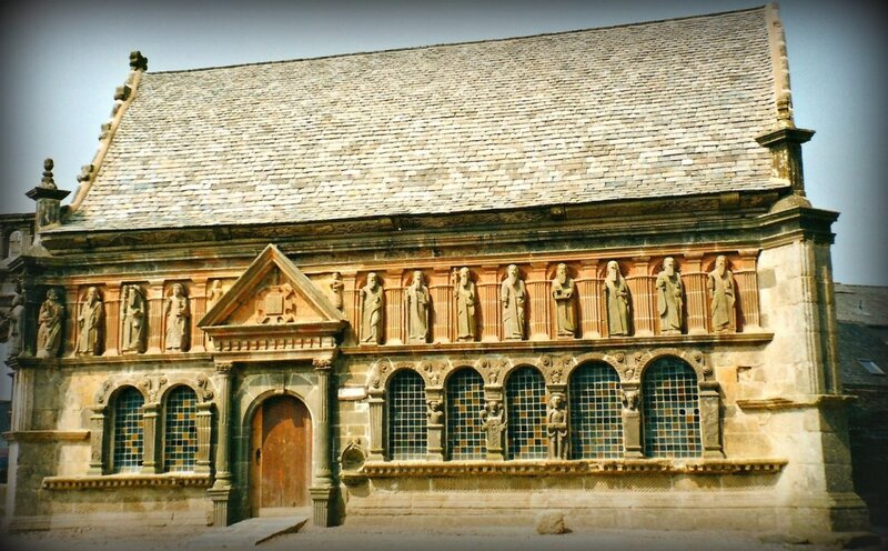 historic stone building with statues