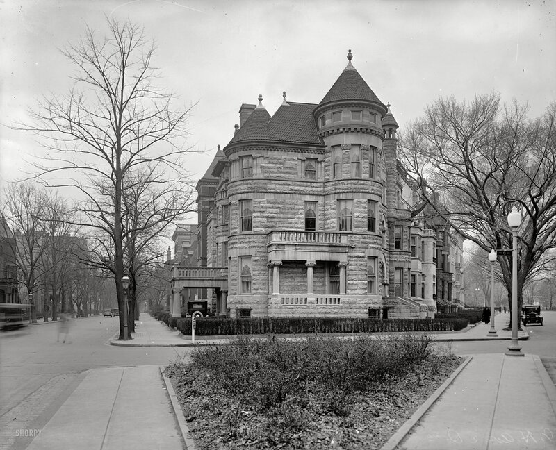 Historic stone mansion on a city street