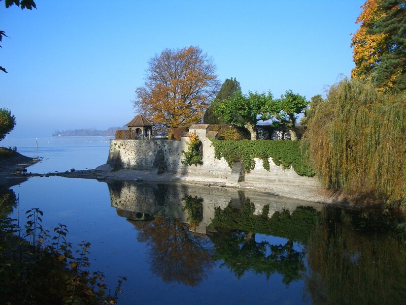 Historic stone wall by lake
