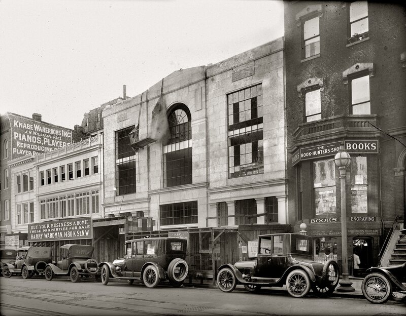 Historic street scene with vintage cars