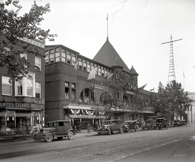 Historic street scene with vintage cars