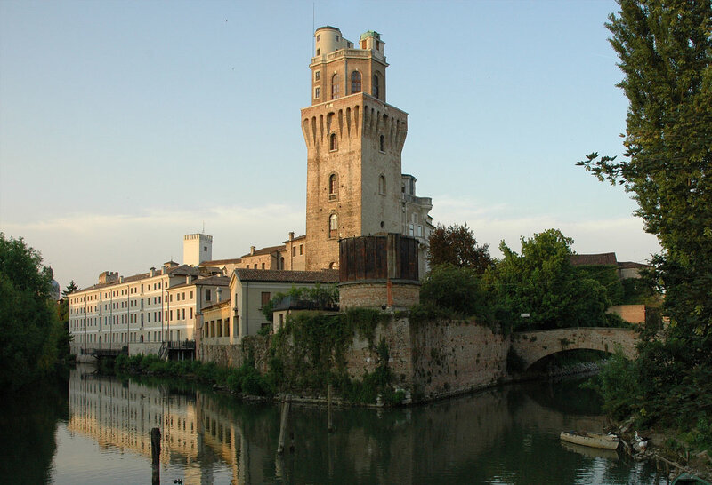 Historic tower by a river
