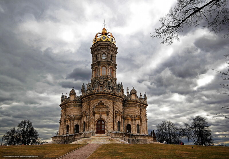 Historic tower under cloudy sky