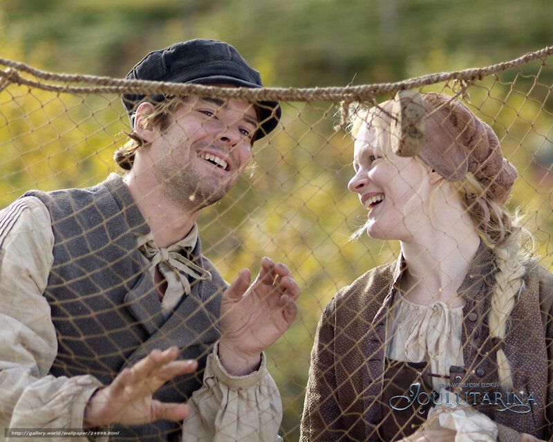 Historical couple laughing behind net