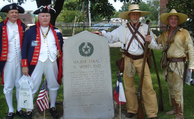 Historical reenactors at a monument