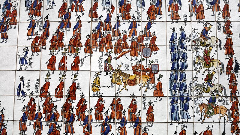 Historical tile mural of officials