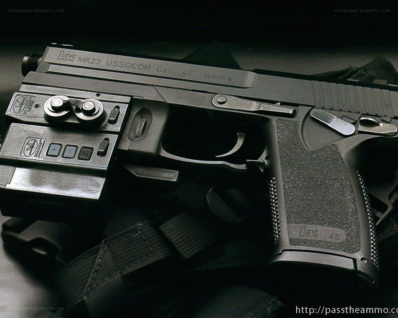 HK MK23 pistol with laser sight