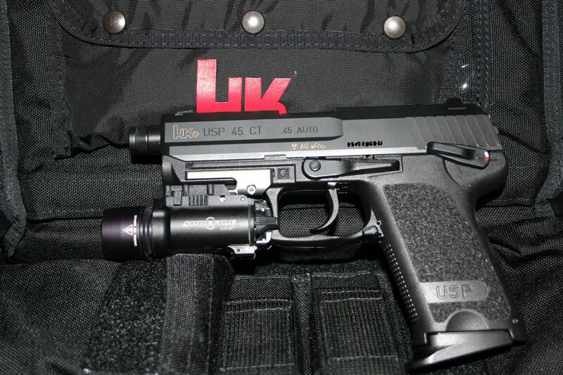 HK USP .45 pistol with light
