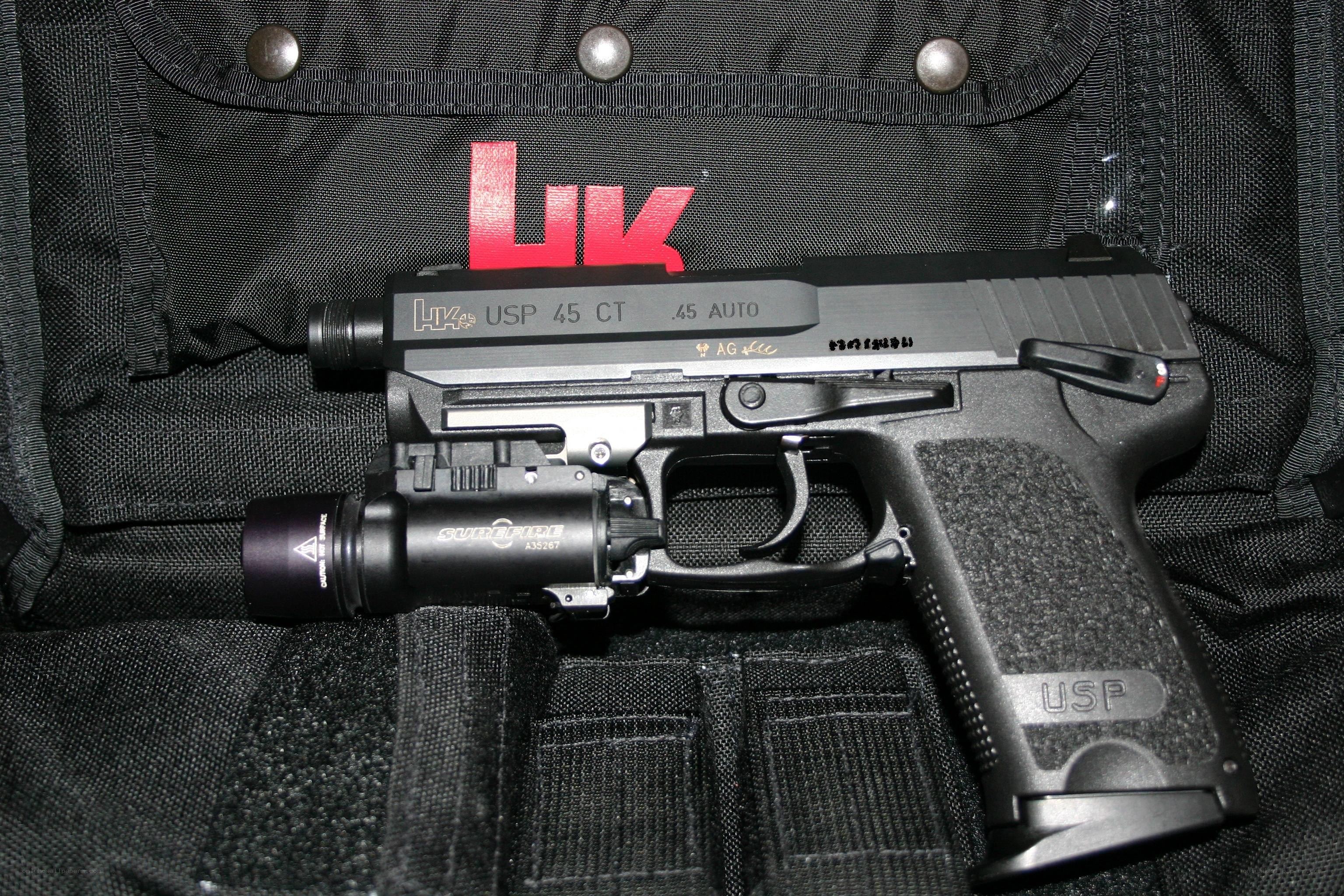 HK USP .45 pistol with light