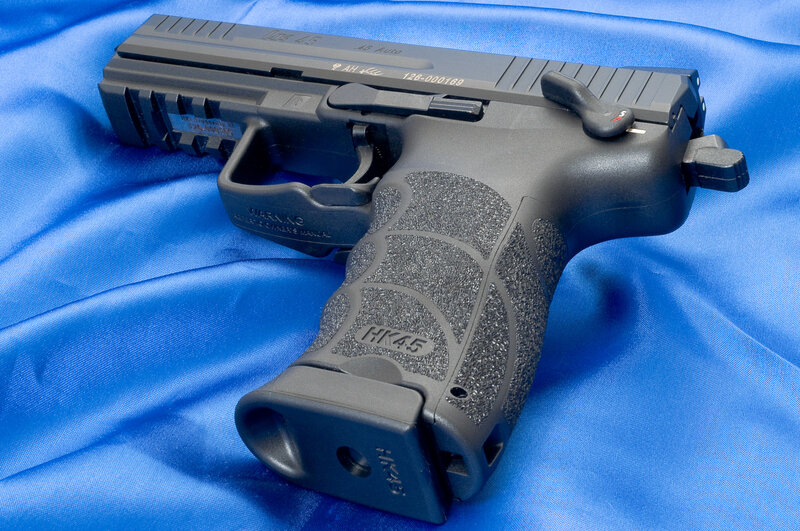 HK45 pistol on blue fabric