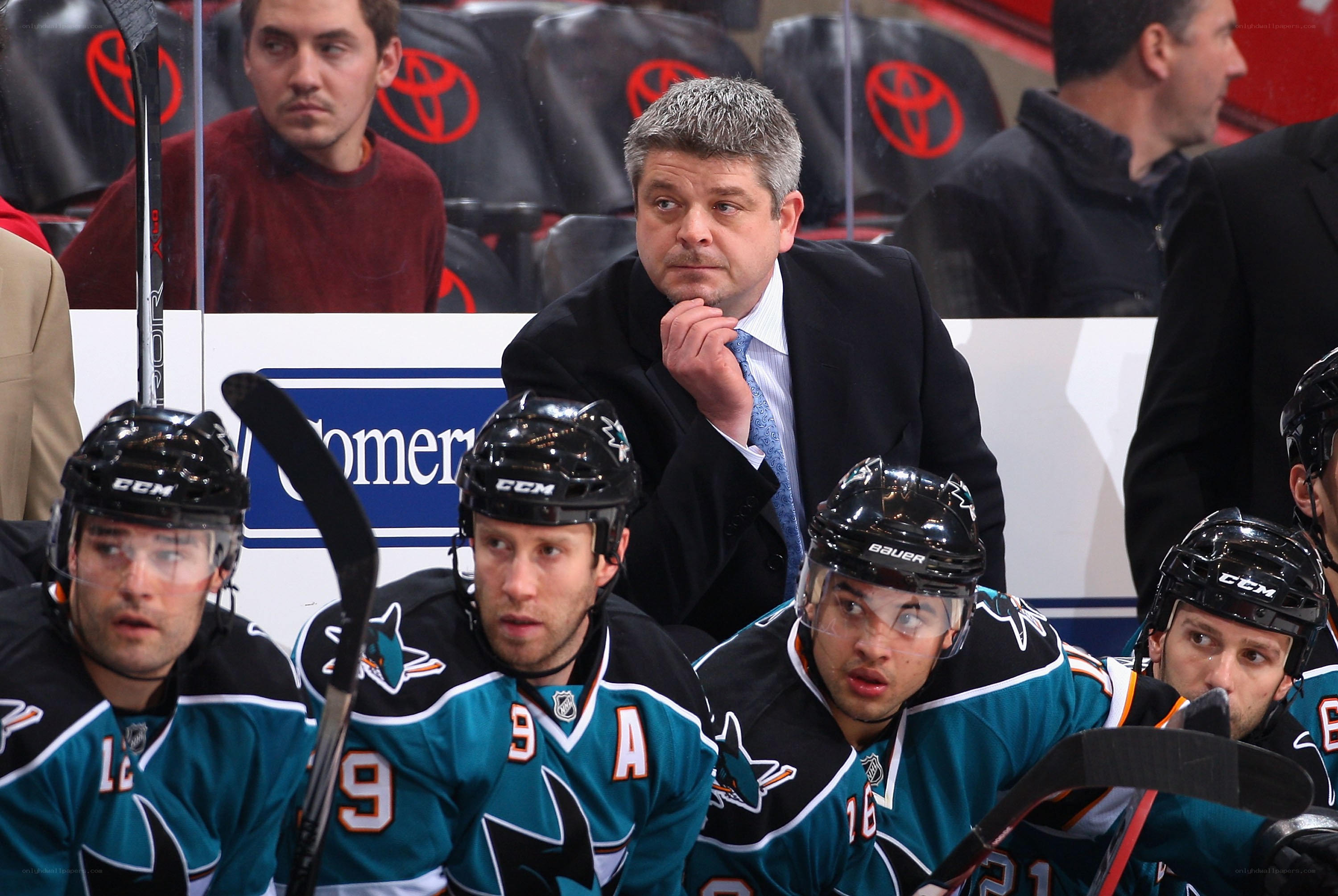 Hockey coach with players