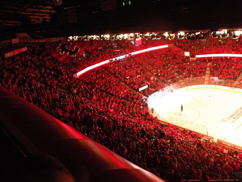 Hockey game in red-lit arena