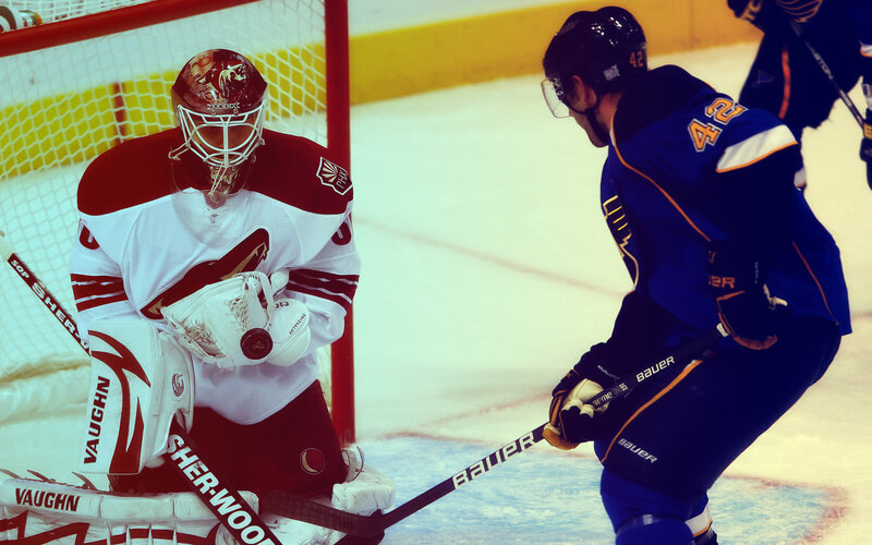 Hockey goalie facing off against opponent