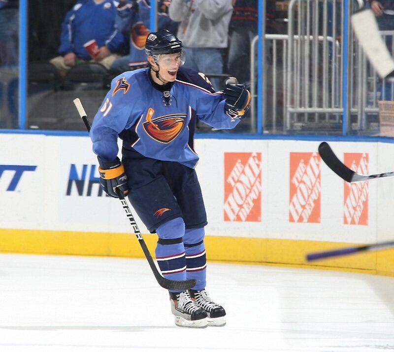 hockey player celebrating on ice