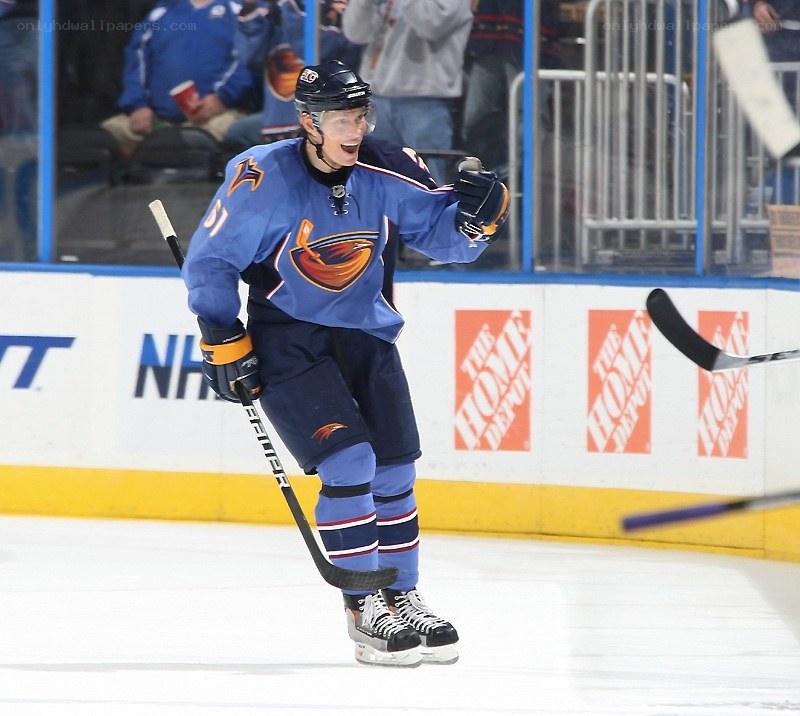 hockey player celebrating on ice