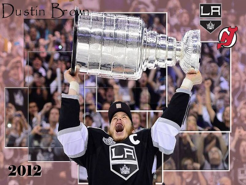 Hockey Player Holding Trophy — Black