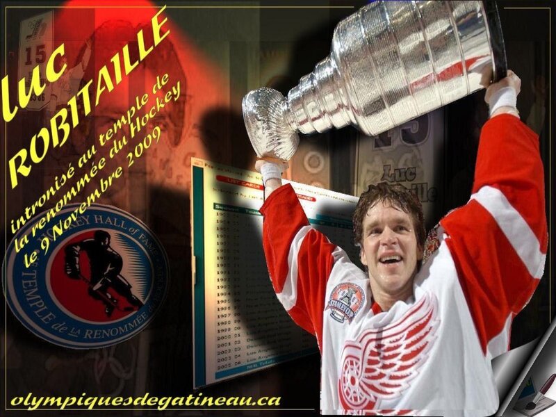 Hockey Player Holding Trophy