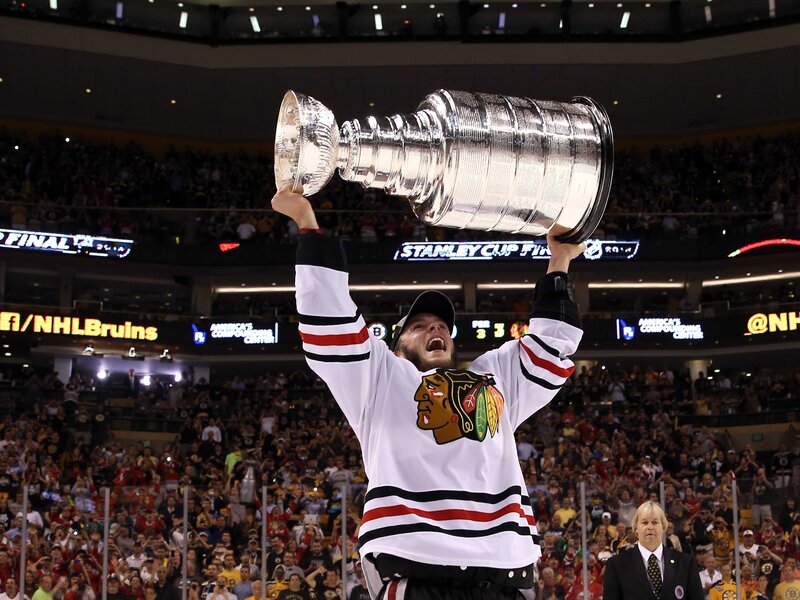 Hockey Player Holding Trophy — White