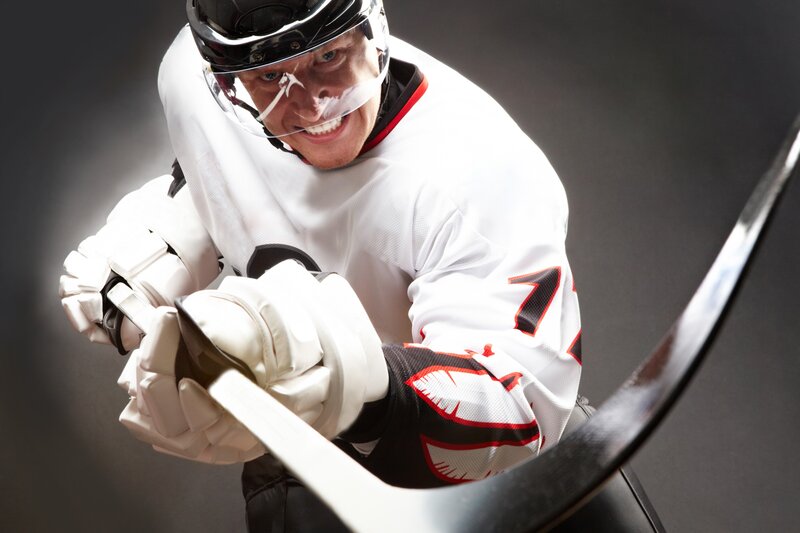Hockey Player in Action — White, Intense, Photograph