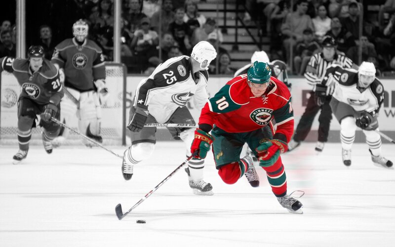 Hockey player in red jersey skating