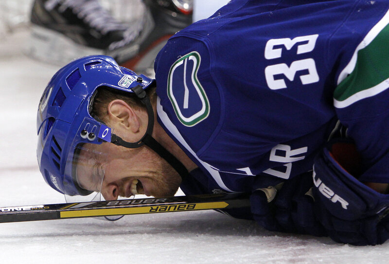 Hockey player on ice in pain