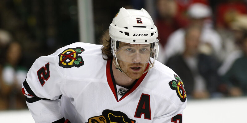 Hockey Player on Ice — White, Focused, Photograph
