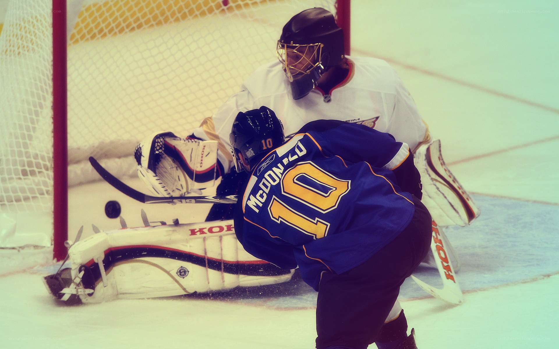 Hockey player scoring goal