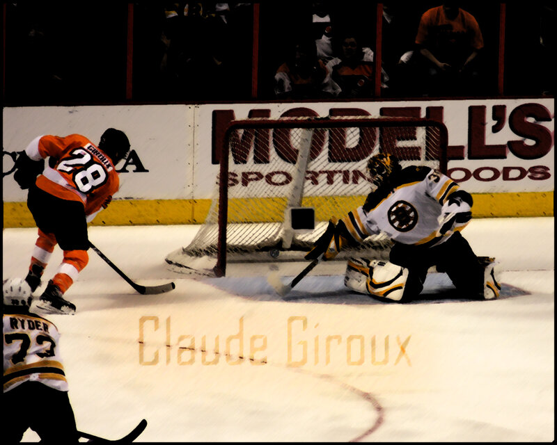 Hockey player shooting on goalie