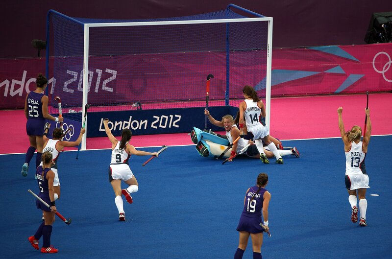 Hockey players celebrate goal